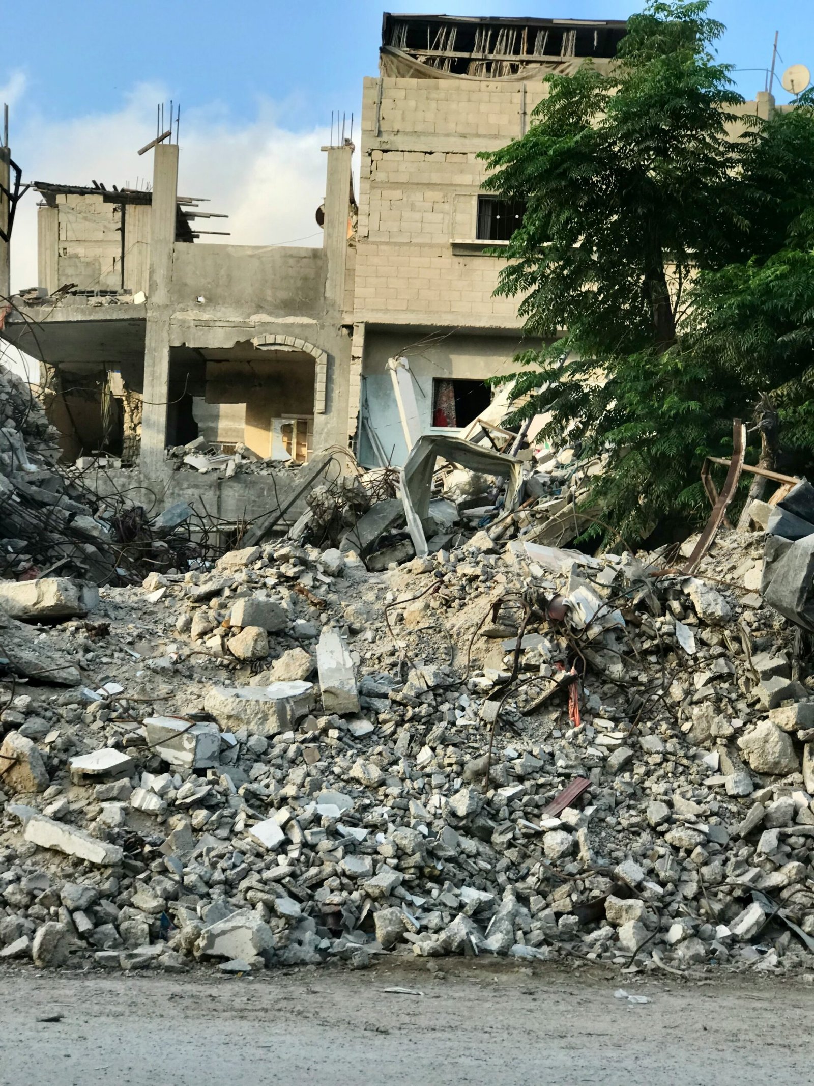 A large pile of rubble next to a building